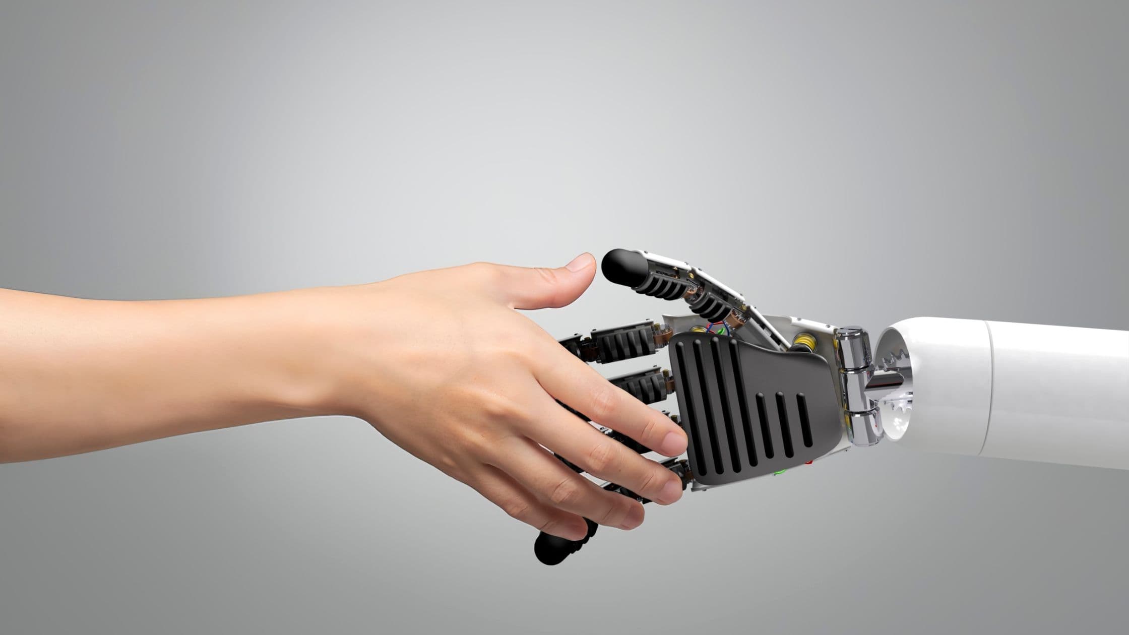 A human hand and a robot hand shaking, representing an AI receptionist handling routine scheduling while staff handle clinical and emergency calls